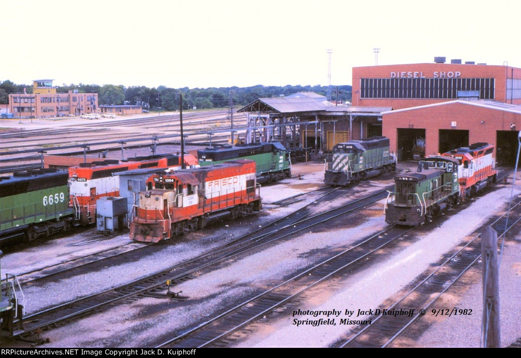 ex-Frisco, Burlington Northern locomotive shops at Springfield, Missouri, with locomotives 1394, 6338, 6652, 6675, 6659, 1000.  September 12, 1982. 